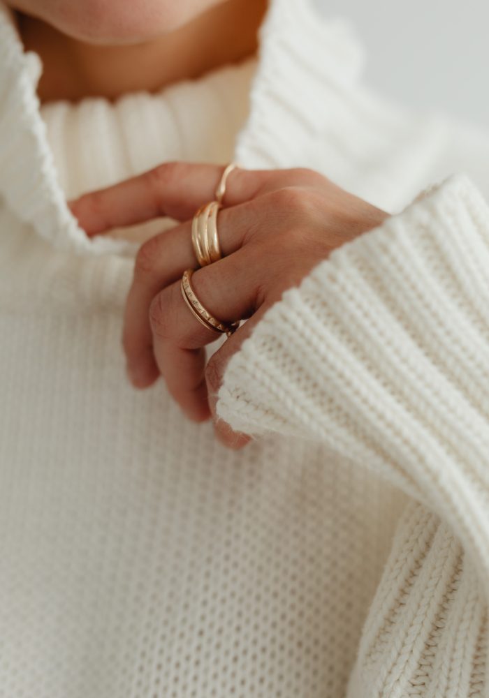 kaboompics_woman-in-white-sweater-gold-rings-jewelry-29420.jpg